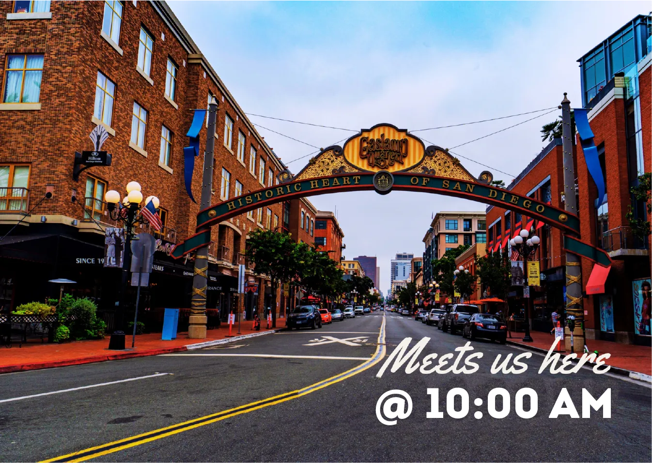 Gaslamp Quarter archway spanning a historic street with brick buildings in San Diego.